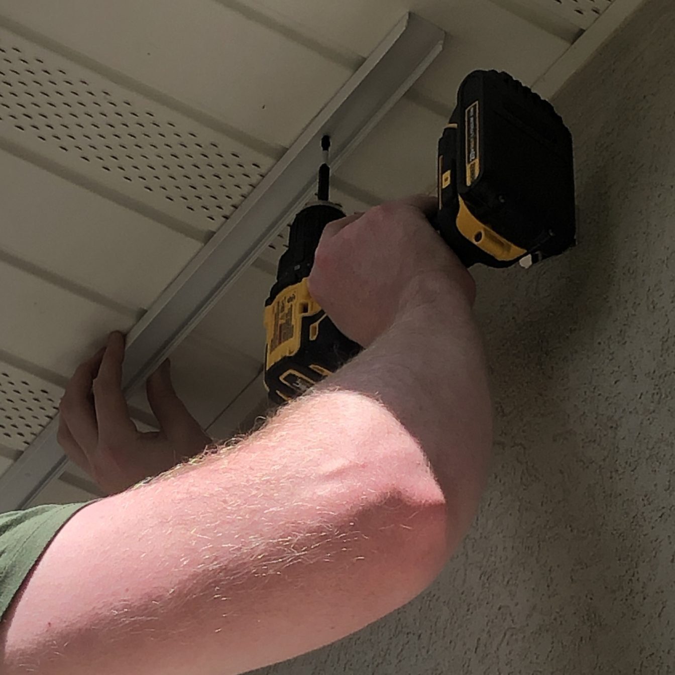 Installing the back piece of channel for permanent Christmas Lights